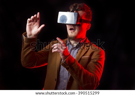 Handsome guy using VR glasses