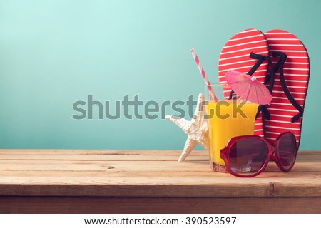 Summer holiday vacation background with orange juice and flip flops