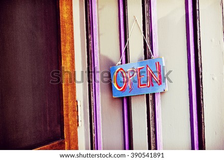 Open sign on an old storefront