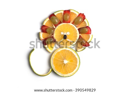 Food art creative concepts. Cute lion made of orange, grapes, strawberry, pineapple and coffee bean isolated on a white background.