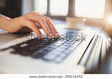 Hand on computer keyboard