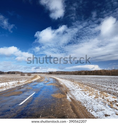 Old automobile road in countryside area in winter.