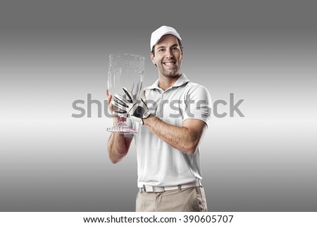 Golf Player in a white shirt celebrating with a glass trophy in his hands, on a white Background.