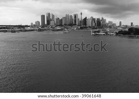 Sydney City CBD skyline view over Harbor black-white cloudy weather