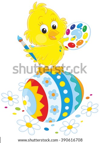 Little yellow chick painted an Easter egg