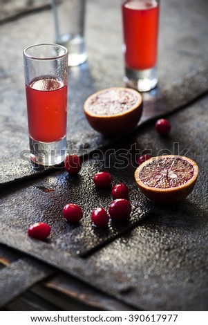 Shot-drink with orange and cranberry