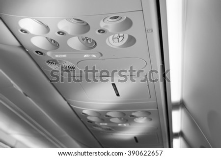 Italy, airplane cabin with the fasten belts and no smoking signs on