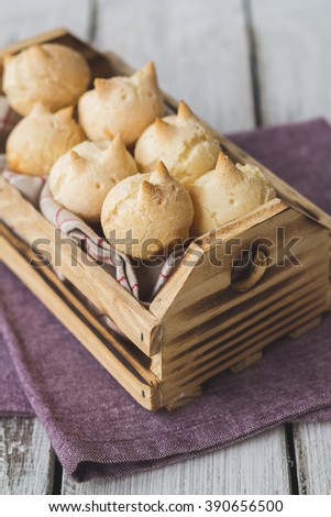 Wooden box with cheese bread on bunnies format