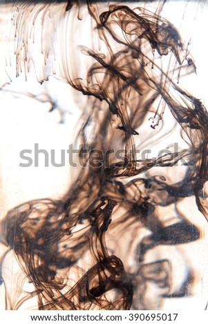 Beautiful ink splash in water isolated on white.