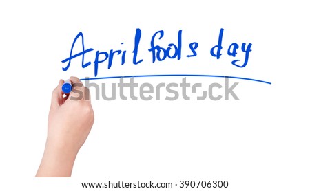 April fools day word write on white background by woman hand holding highlighter pen
