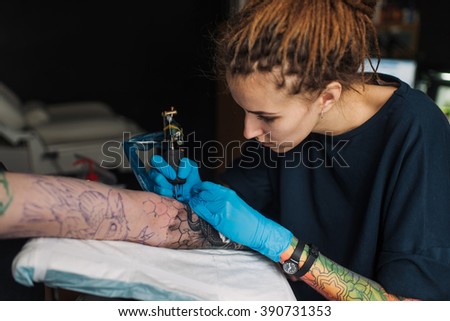 Tattoo Girl With Dreadlocks On His Head In The Stuffing
