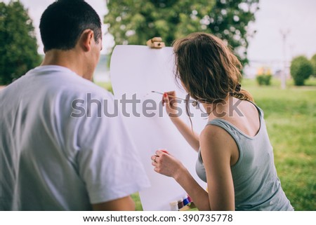 Couple painting on a canvas