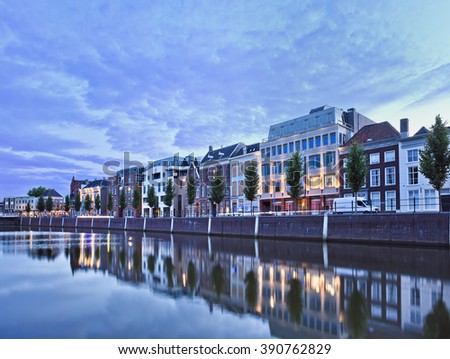 Stately mansions mirrored in a harbor at twilight, Breda, The Netherlands Royalty-Free Stock Photo #390762829