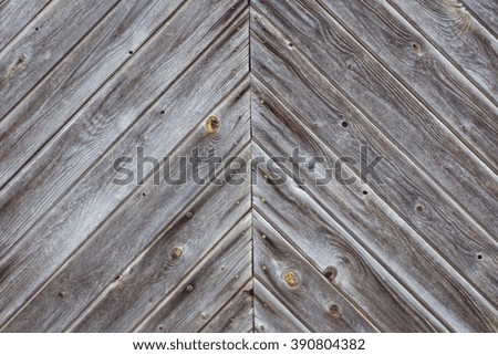 Angled joining wooden slats, bleached from the sun