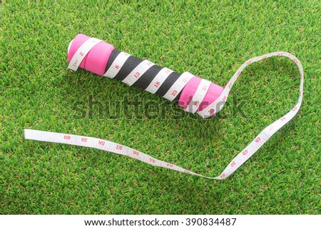 dumbbell with tape measure, exercise concept