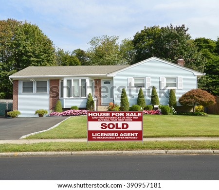 Real estate sold (another success let us help you buy sell your next home) sign Beautiful Landscaped Suburban Ranch Style Home Residential Neighborhood USA