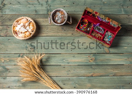 necklace and beads on a wooden background