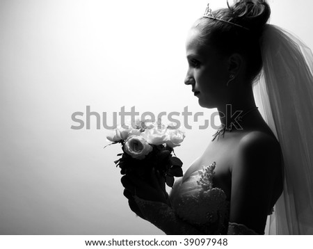 Beautiful bride portrait with flowers in her hand