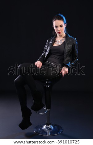 beautiful young woman on black background