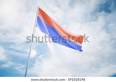 Waving serbian flag isolated on a sky background