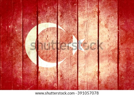 Turkey wooden grunge flag. Turkey flag painted on the old wooden planks. Vintage retro picture from my collection of flags.