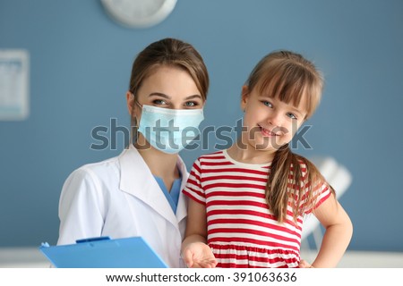 Doctor and little girl in the office