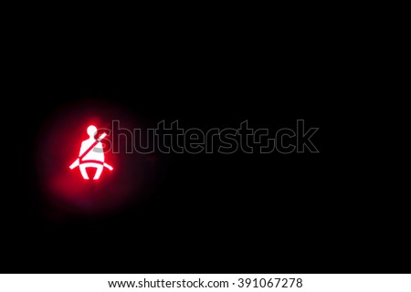 Seatbelt light showing on the black background Royalty-Free Stock Photo #391067278