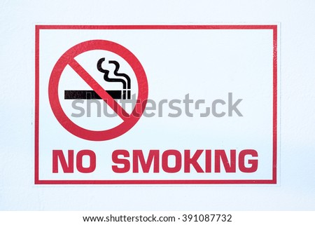 No Smoking sign on a white wall