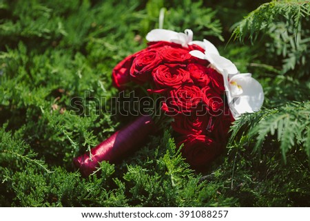 Beautiful red roses & white flowers wedding bouquet closeup