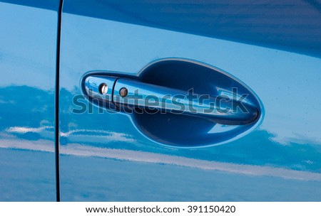 Blue car door handle
