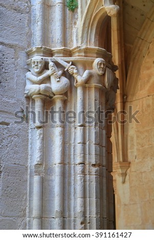 Stone carvings decorate a column of the Monastery of Santa Maria de Santes Creus in Catalonia, Spain