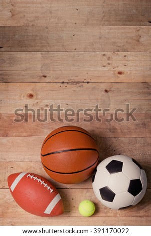 Sports balls on wooden background