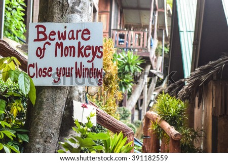This sign illustrates that monkeys may cause danger in Thailand. 