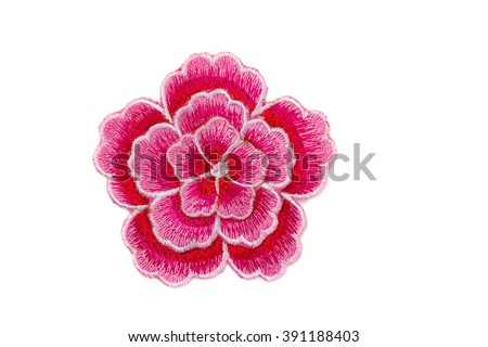 Embroidered red flower. Isolate on white. Royalty-Free Stock Photo #391188403