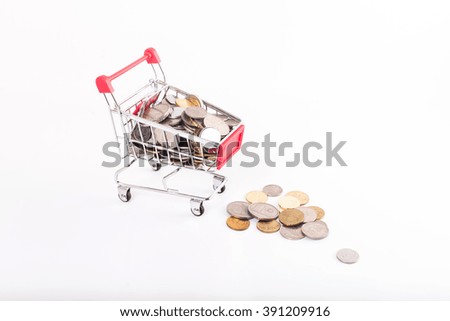 shopping trolley bring coins with white background