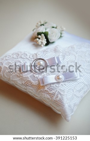 wedding rings on ring barer pillow