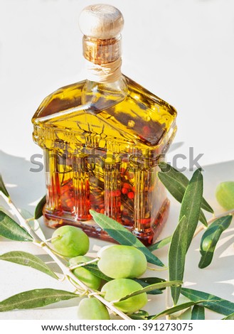 green olives and olive oil with spice and herbal
