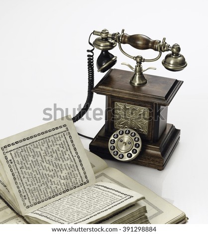 ancient phone and books on a white background