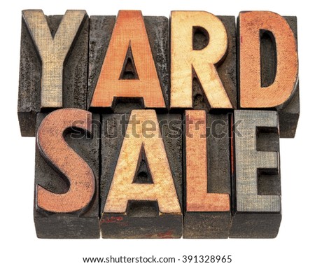 yard sale banner  - isolated text in vintage letterpress wood type printing block stained by color inks