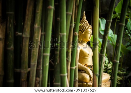 Golden Buddha in the Bamboo Forest. Royalty-Free Stock Photo #391337629
