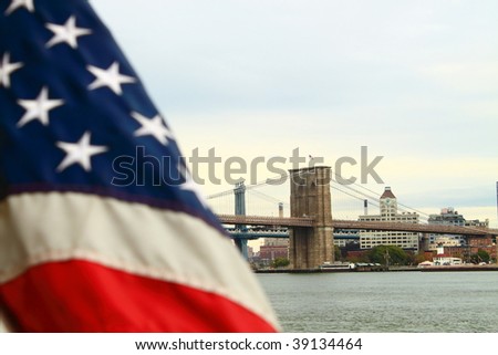 American flag and Brooklyn Bridge