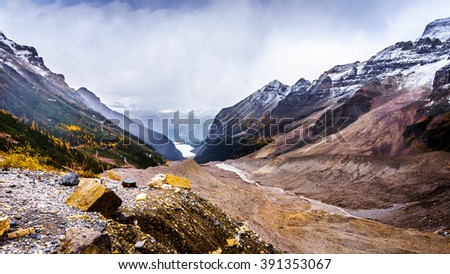 View of Lake Louise from the lateral moraine at the Plain of Six Glaciers at an elevation of 2150 meters or 7000 feet in Banff National Park in the Canadian Rocky Mountains Royalty-Free Stock Photo #391353067