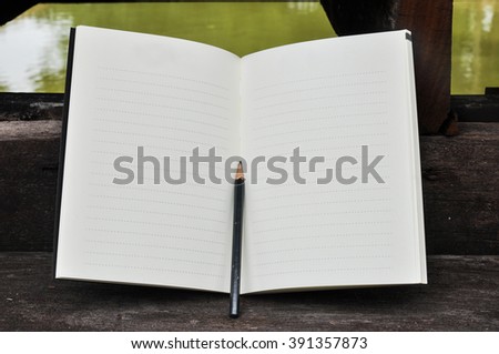 White blank pages sketch book on wood table vertical,blank spiral notebook and pencil on dark wood background