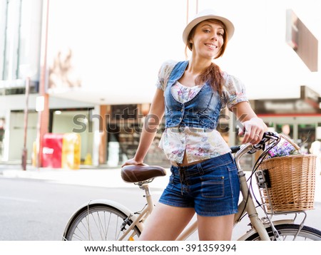 Beautiful woman riding on bike