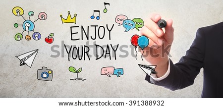 Businessman drawing Enjoy Your Day concept with a marker