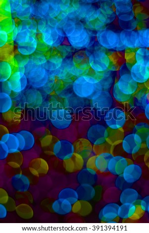 Circular bokeh background of many colors together.