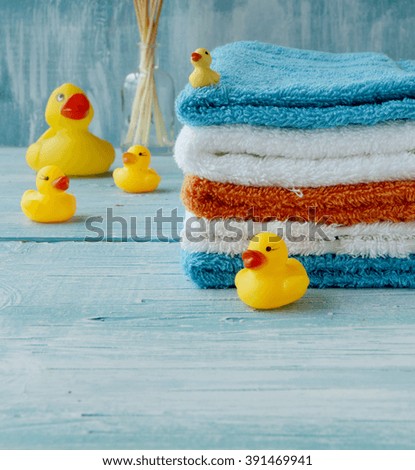 stack of colorful towels on the table, accessories for the bathroom