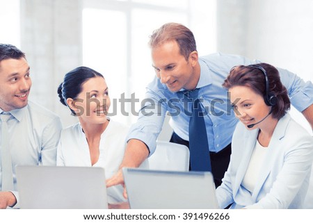 picture of group of people working in call center or office