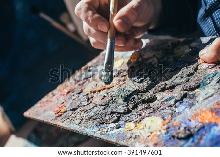 Artist painting an abstract oil picture