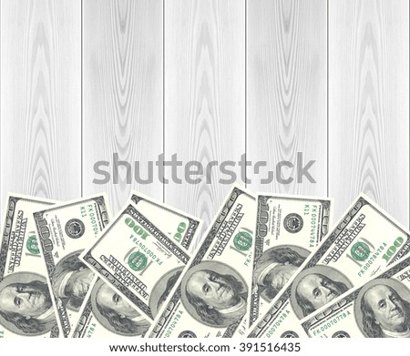 Dollars over wood background